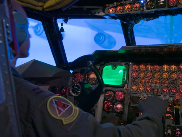 An air force pilot trains on a B-52 Stratofortress. An actual flight in a B-52 bomber costs approximately $16,000 per hour, while the flight simulator costs approximately $400 per hour to operate.
